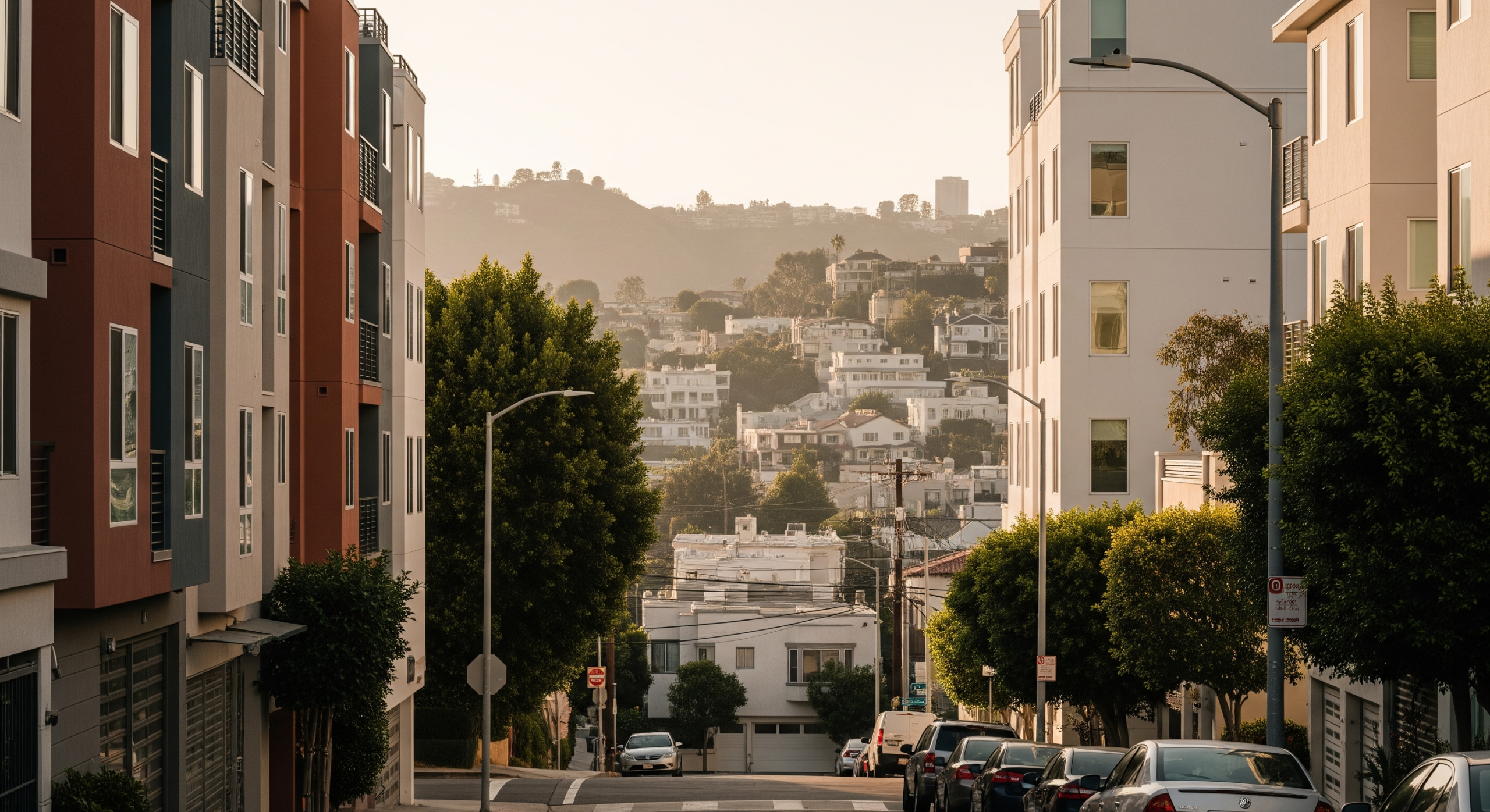 Urban hillside neighborhood with residential buildings in Los Angeles.