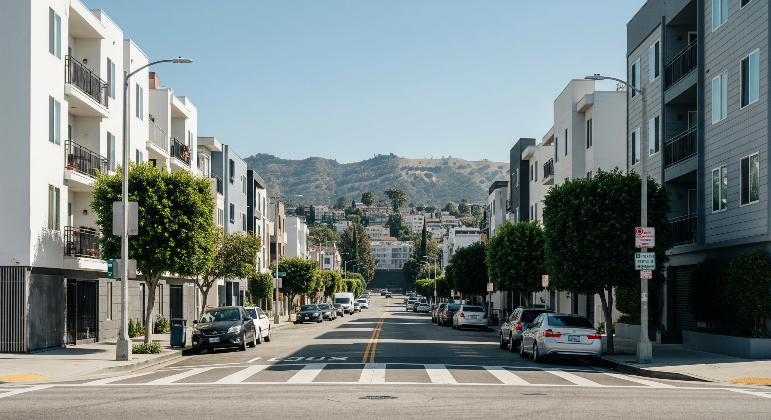 Residential street in Hollywood with apartments and hillside views